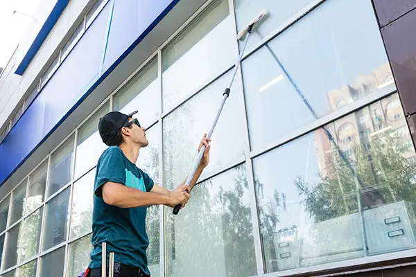 Person Cleaning an Exterior Window